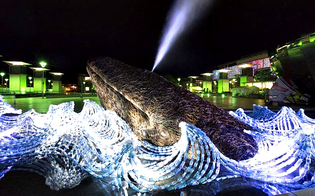 The Bristol Whales sculpture at night